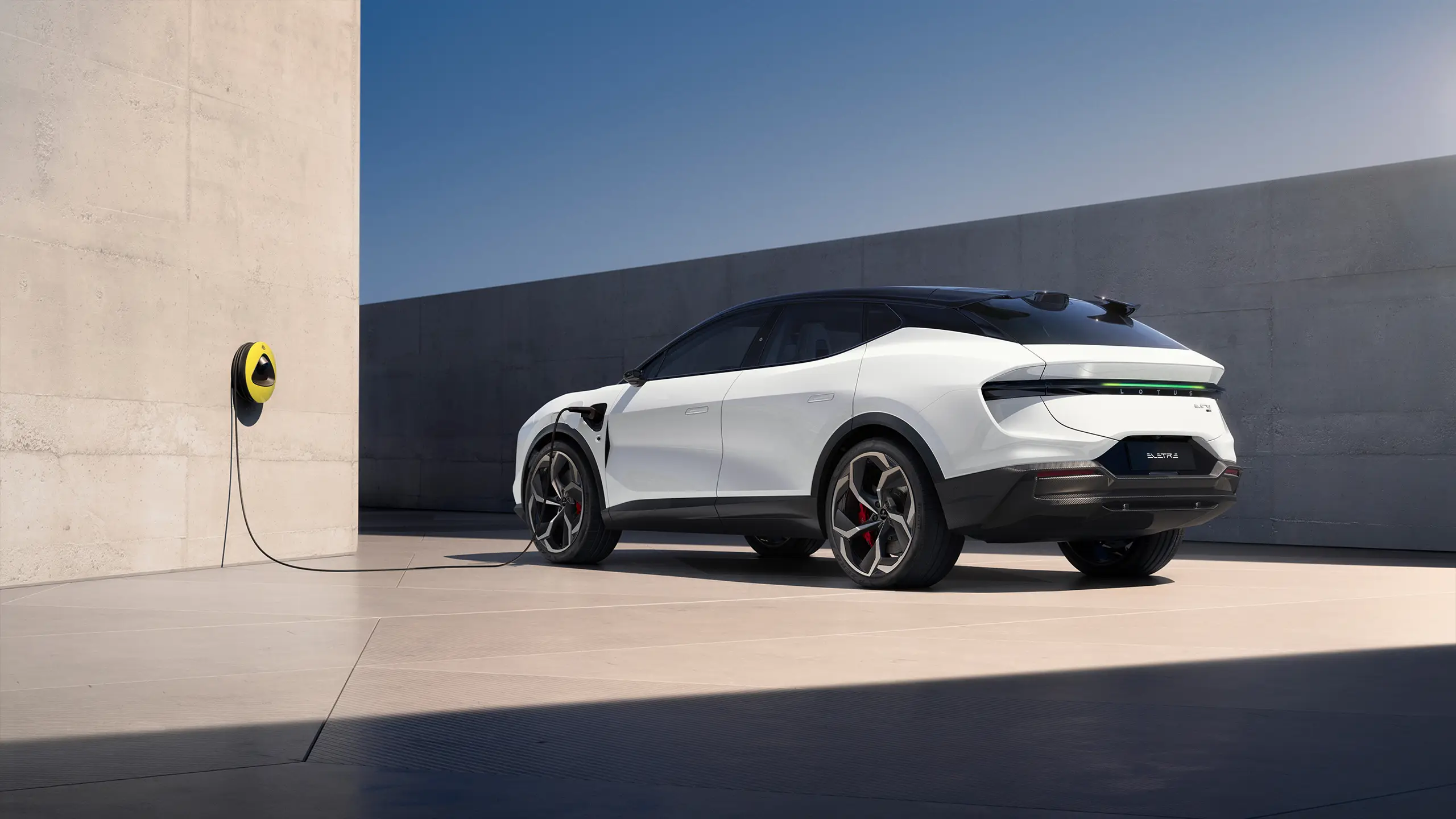 Lotus Eletre parked beside an EV charging point