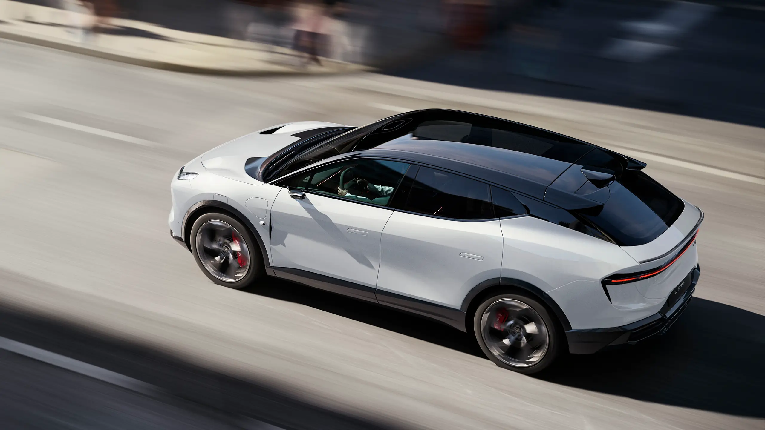 Lotus Eletre driving through a city from an elevated angle